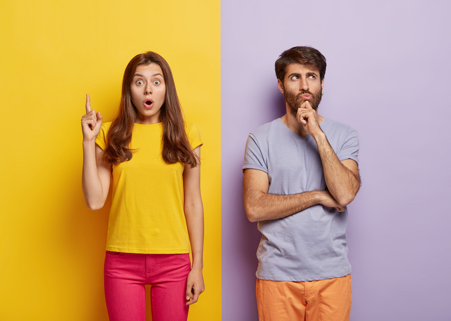 surprised-woman-pointing-upwards-next-to-man-with-thinking-expression-on-freepik
